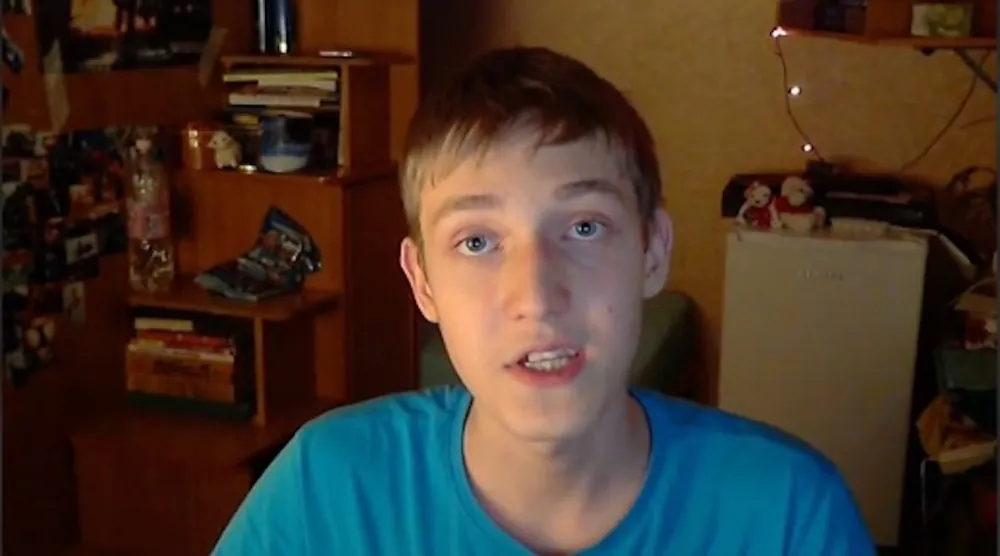 Evgeny at 14 recording one of his first YouTube videos in his bedroom