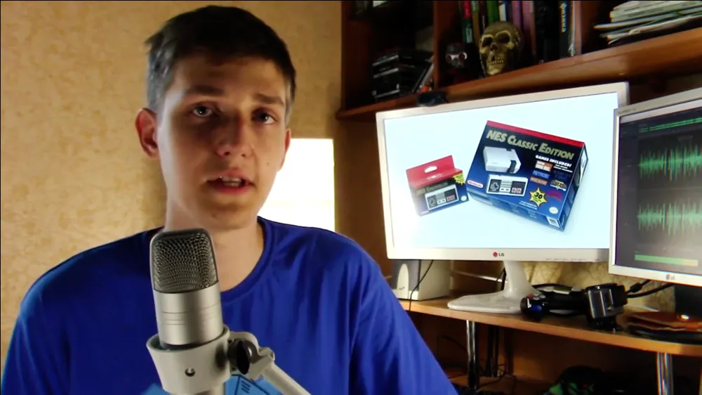 Teenage Evgeny at his desk with a microphone and a computer