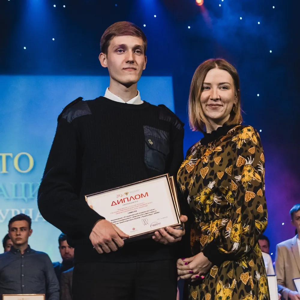 Evgeny receiving a diploma for first place a year later