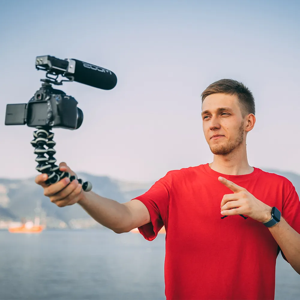 Evgeny vlogging with a camera by the sea