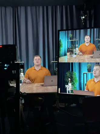 Podcast set: the camera monitor shows the live frame