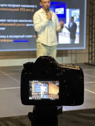 Filming a founder on stage at a conference
