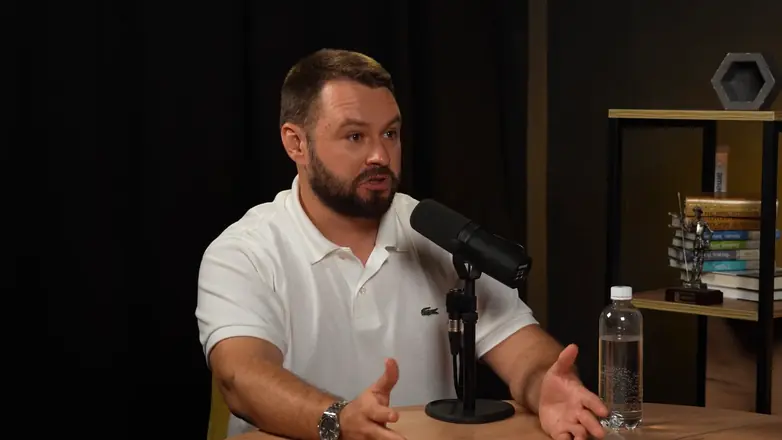 Final frame from a client video: podcast, host close-up