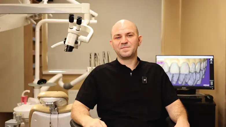 Final frame from a client video: dentist in his clinic, medium shot