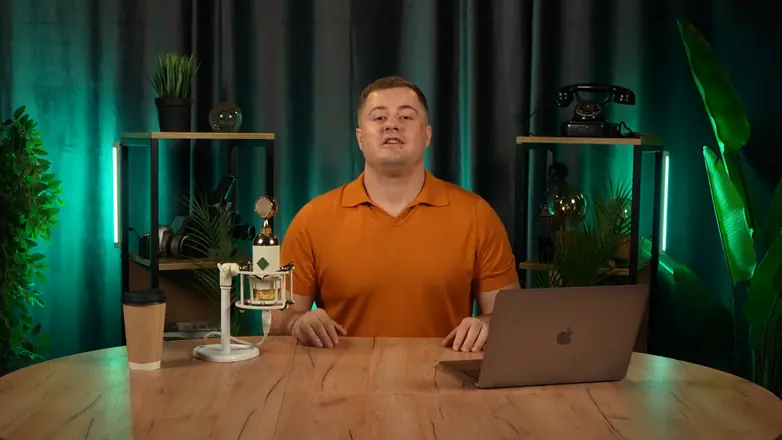 Final frame from a client video: expert in a studio set, wide shot