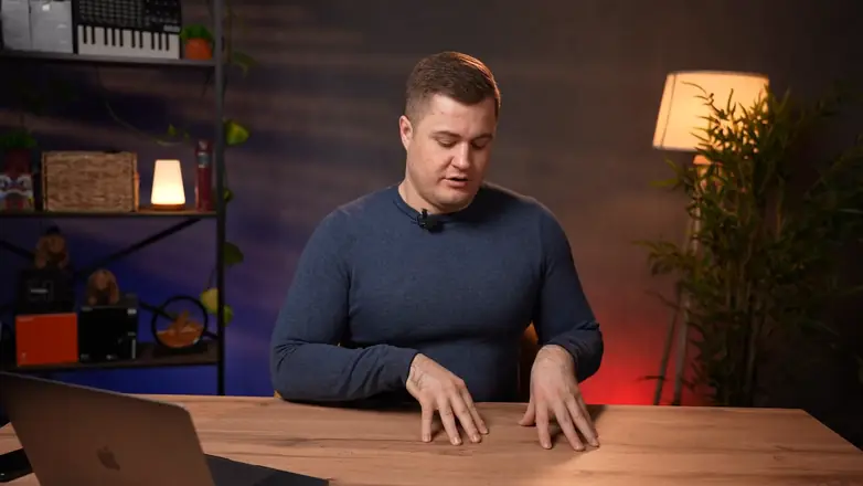 Final frame from a client video: expert at a desk, wide shot