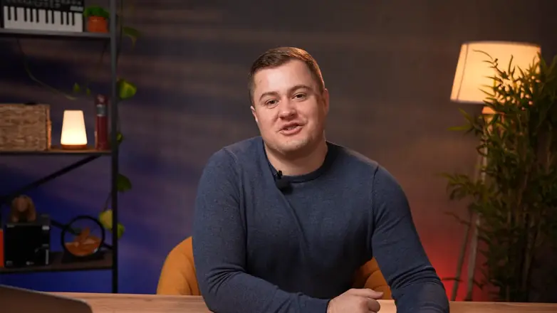 Final frame from a client video: expert at a desk, close-up