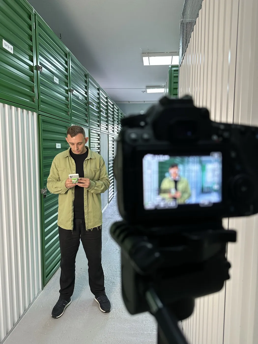 Camera monitor during a shoot in a storage corridor